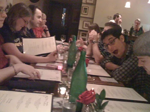 Conjunctured members working together at a table